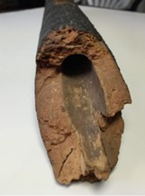 Figure 3b - Original wooden gas mains made from white pine logs. Photo credit Alan Aftanas, Manitoba Hydro Archives